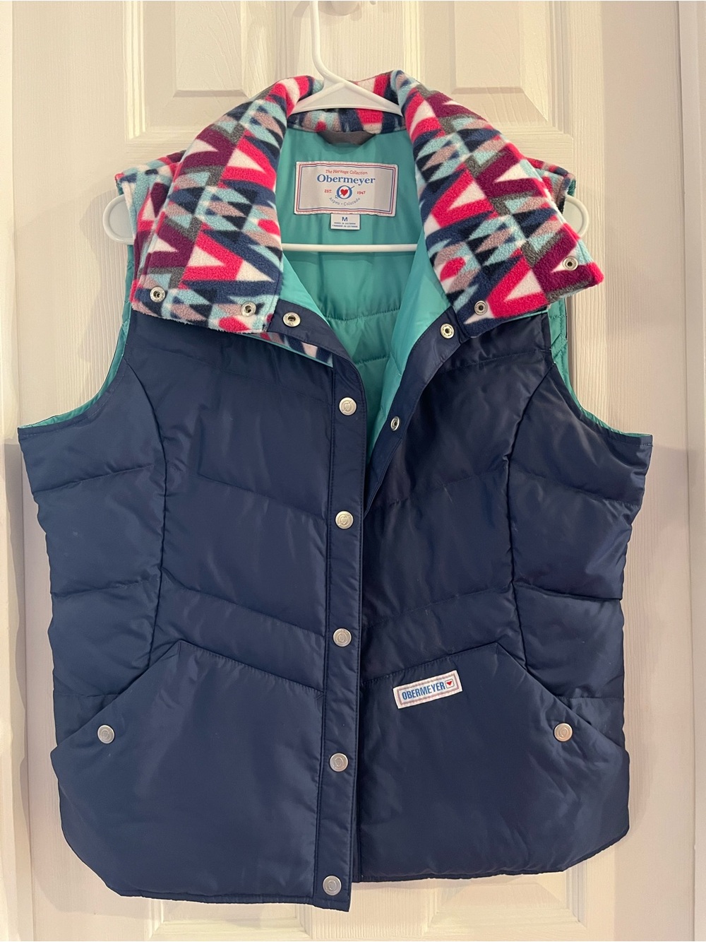 Obermeyer Navy Puffer Vest with Turquoise Lining and Geometric Collar